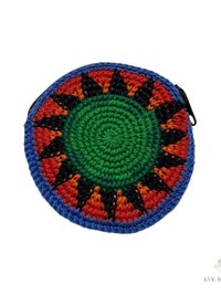 A round, crocheted coin pouch with a green center, surrounded by orange, black, and blue geometric patterns, and a zipper on one side. The background is white with a small watermark in the bottom right corner.